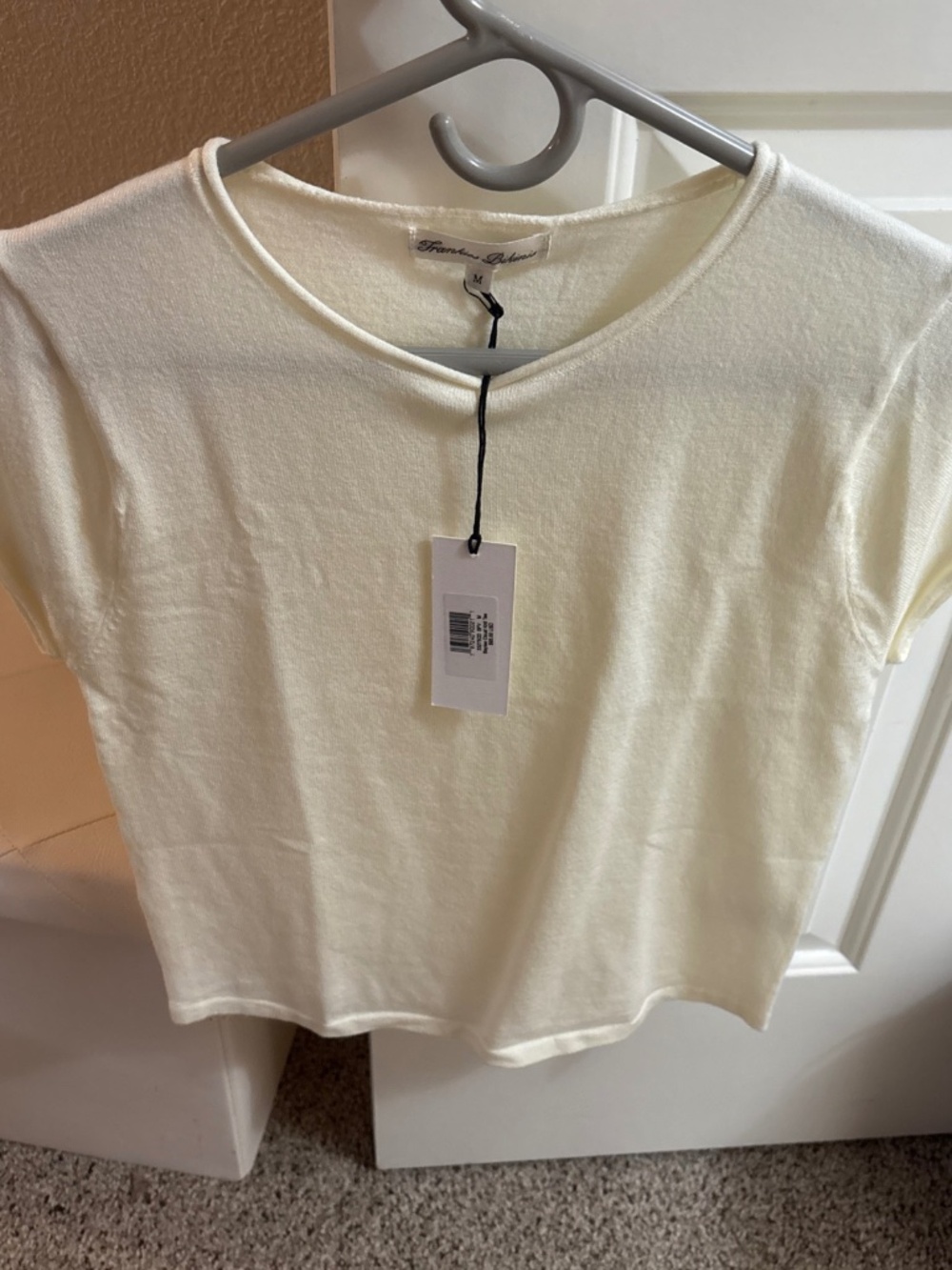 Frankie’s bikinis cloud, short sleeve top New with the tag size medium
